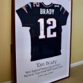 C01. Framed autographed Tom Brady jersey. 